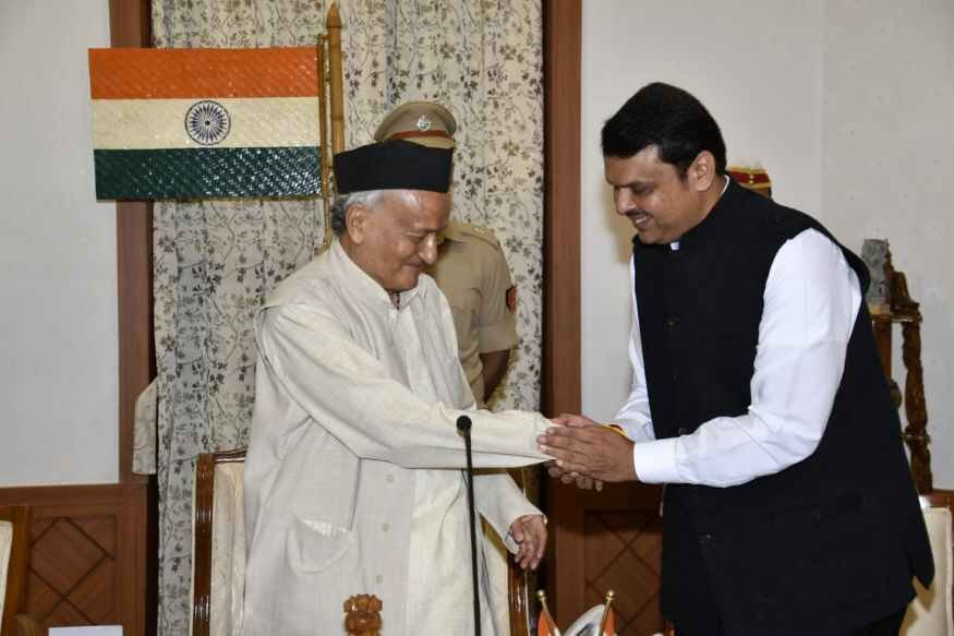 Governor Bhagat Singh Koshyari shaking hands with Devendra Fadnavis after the latter was sworn-in as Maharashtra Chief Minister for a second term.