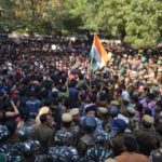 JNU students and police clash in New Delhi as the students attempt to march towards the parliament, on Monday.