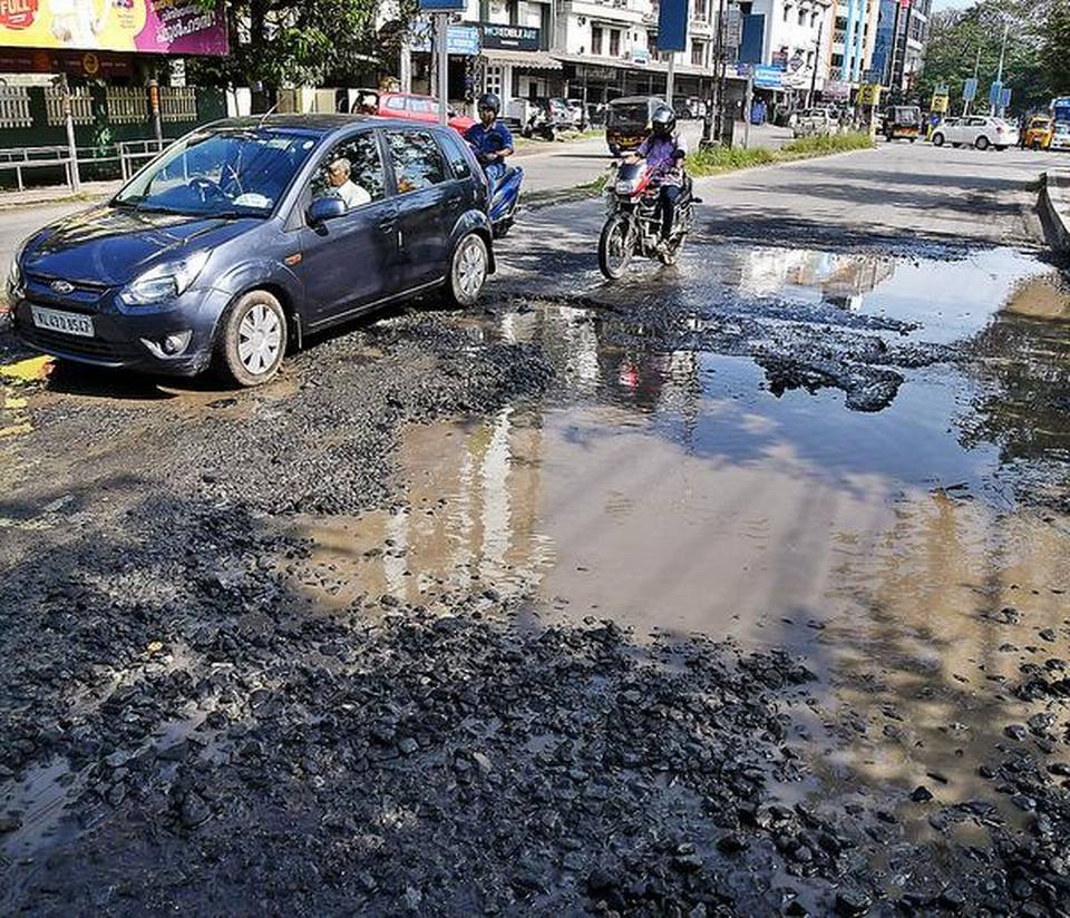 The badly-damaged Kaloor-Kadavantra road;