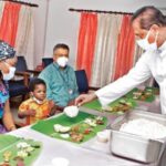Fr Paul Karedan serving Onasadya to Jin and his mother at Lisie Hospital
