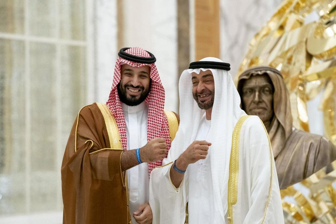 Sheikh Mohamed bin Zayed and Prince Mohamed bin Salman bin Abdulaziz pose for a photo wearing Expo 2020 wristbands at Qasr Al Watan during the Crown Prince's visit to Abu Dhabi in November, 2019. Hamad Al Mansoori / for the Ministry of Presidential Affairs