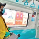 A worker carrying out disinfection inside a Metro coach recently.