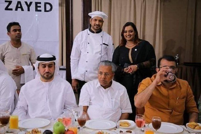 Kerala Chief Minister (Seated front row) with Kerala gold scam accused Swapna Suresh (Behind in black dress) during an official meeting with UAE diplomats