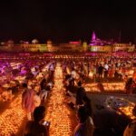 Devotees light earthen lamps on the bank of Saryu River during Deepotsav celebrations in Ayodhya in 2019.