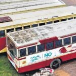 A worker washes buses on the hartal day at the KSRTC bus stand in Ernakulam on Monday.