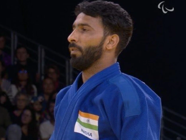 Kapil Parmar with his bronze medal at the Paralympics, celebrating his historic achievement in judo after a long struggle and recovery.