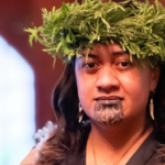 Nga Wai Hono i te po Paki in traditional Maori dress, including fern headdress and carved whalebone necklace, during her coronation ceremony.