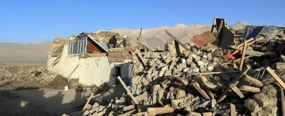 Rescue workers navigating debris in Tibet after a powerful earthquake, distributing blankets to affected residents.