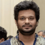 ED officials conducting raid outside film producer Akash Baskaran’s residence in Chennai amid ₹1000 crore TASMAC scam probe.